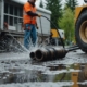 High-pressure water jetting service cleaning a residential sewer line with professional equipment.