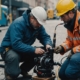 Trenchless pipe installation by technician in city