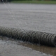 High-pressure water jet cleaning a dirty concrete surface, demonstrating the benefits of local water jetting services.